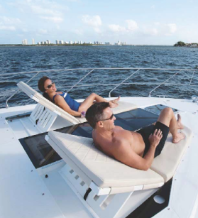 Couple lounging on a Cruisers Yacht