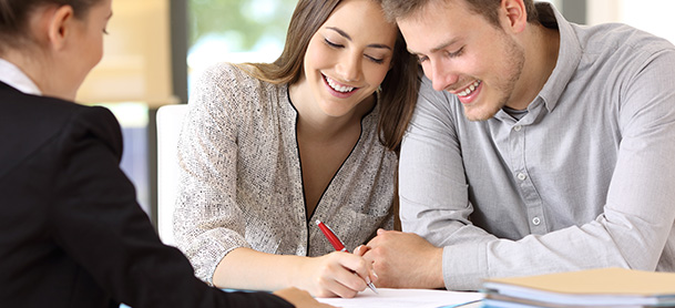 Man and woman looking over finance paperwork