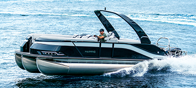 Man driving Harris Grand Mariner in water