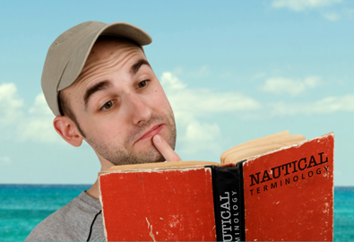 Man reading nautical terms dictionary