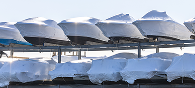 Boats stored and wrapped at a marina