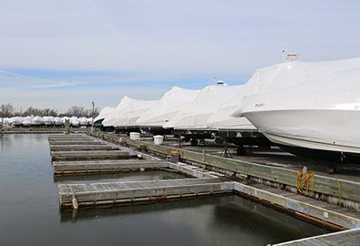 Row of boats wrapped for winter