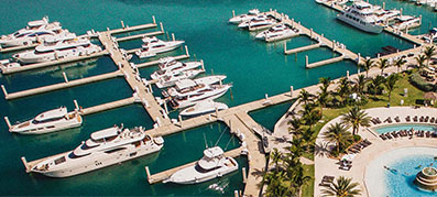Aerial view of a marina with multiple boats docked