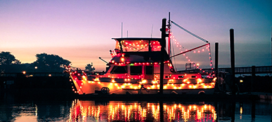 Spooky Boat lit up on the water
