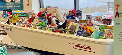 a boston whaler filled with christmas toys