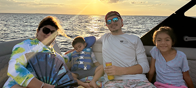 Gabriel Aldana and family aboard their Sea Ray 