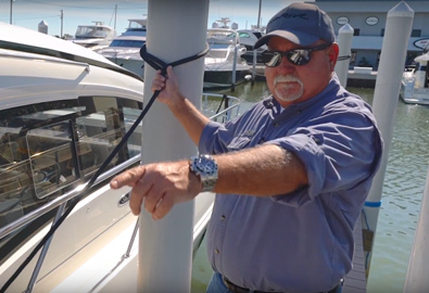 Captain Keith on the docks, tying up a Sea Ray Sundancer 400