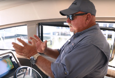 Man talking and moving his hands - MarineMax Boating Tips Video About Cummins Inboard Joystick