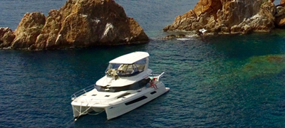 Yacht at sea near islands