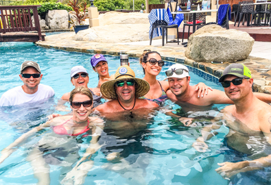 group enjoying time in a pool